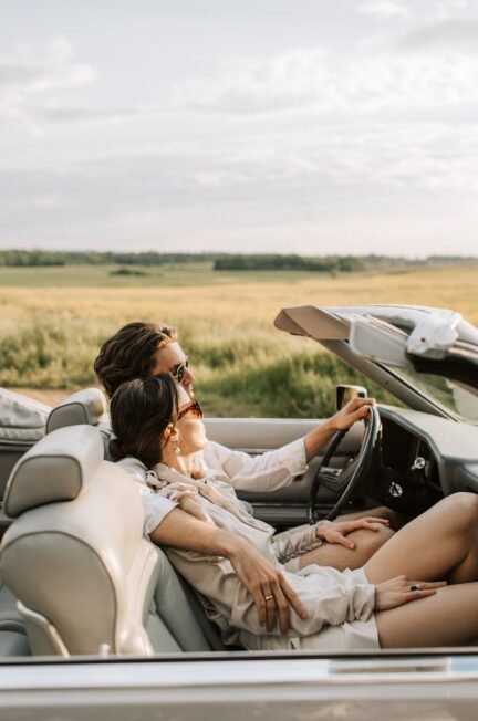 a-romantic-couple-sitting-on-the-car