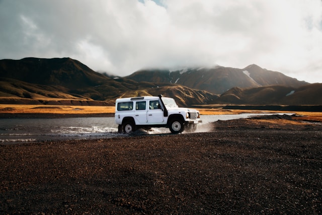 white-car-crossing-body-of-water